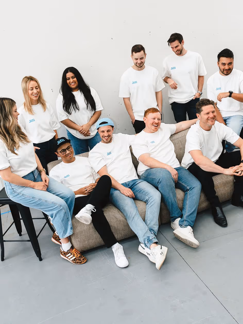 Jiffi team sitting in a couch.